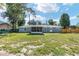 A spacious backyard, complemented by mature trees, offers privacy and space for outdoor activities at 1812 Se 38Th Ave, Ocala, FL 34471
