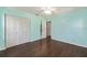 Bright bedroom features hardwood floors, doors, and light-blue walls at 1812 Se 38Th Ave, Ocala, FL 34471