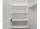 Closet with built-in shelving and closet door at 1812 Se 38Th Ave, Ocala, FL 34471