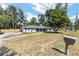 Attractive single-story home with brick details, set back on a large lot featuring mature trees and green space at 1812 Se 38Th Ave, Ocala, FL 34471