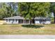 Inviting single-story home featuring a classic design, fresh paint, brick accents, and a well-manicured front yard at 1812 Se 38Th Ave, Ocala, FL 34471