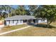 Beautiful single-story home with fresh paint, brick accents, and a well-maintained walkway leading to the entrance at 1812 Se 38Th Ave, Ocala, FL 34471