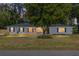 Charming single-story home featuring a brick facade and mature landscaping at 1812 Se 38Th Ave, Ocala, FL 34471