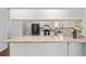 Bright kitchen showcasing granite countertops, modern appliances, and stylish backsplash at 1812 Se 38Th Ave, Ocala, FL 34471