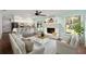 Cozy living room with white brick fireplace and backyard access at 1812 Se 38Th Ave, Ocala, FL 34471