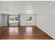 Inviting living room with hardwood floors and ample natural light from large windows at 1812 Se 38Th Ave, Ocala, FL 34471