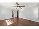 Main bedroom featuring hardwood floors, a ceiling fan, and an ensuite bathroom at 1812 Se 38Th Ave, Ocala, FL 34471