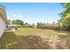 Expansive backyard features lush greenery and a private, fenced-in perimeter for serene outdoor enjoyment at 2 Hemlock Trace Run, Ocala, FL 34472