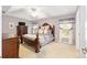 Spacious bedroom featuring a decorative tray ceiling and neutral color palette at 2 Hemlock Trace Run, Ocala, FL 34472