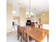 Spacious dining area showcases wooden furniture and seamless connection to adjacent living spaces at 2 Hemlock Trace Run, Ocala, FL 34472