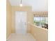 Bright entryway featuring tile flooring, neutral walls, and a decorative window at 2 Hemlock Trace Run, Ocala, FL 34472