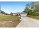 Inviting home with a spacious two-car garage and a well-kept lawn, blending comfort and convenience for modern living at 2 Hemlock Trace Run, Ocala, FL 34472