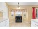 Bright kitchen nook features a bay window with floral valance and a built in wine rack at 2 Hemlock Trace Run, Ocala, FL 34472