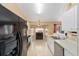 Open layout kitchen features stainless steel appliances and a cozy breakfast nook at 2 Hemlock Trace Run, Ocala, FL 34472