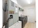 Practical laundry area equipped with modern washer and dryer units and ample storage space at 2 Hemlock Trace Run, Ocala, FL 34472