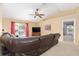 Living room featuring a ceiling fan, television, and a sliding glass door at 2 Hemlock Trace Run, Ocala, FL 34472