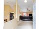 Open-concept living room with a leather couch and neutral-colored walls at 2 Hemlock Trace Run, Ocala, FL 34472