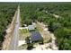 A scenic aerial view of two homes surrounded by lush greenery, creating a peaceful and private setting at 22777 Sw Beach Blvd, Dunnellon, FL 34431