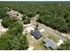 New construction homes are nestled on a lot with mature trees in a rural area at 22777 Sw Beach Blvd, Dunnellon, FL 34431