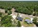 Overhead shot of two modern homes on large lots surrounded by trees, offering a peaceful rural lifestyle at 22777 Sw Beach Blvd, Dunnellon, FL 34431