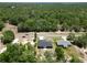 Aerial shot of two houses surrounded by trees, offering a blend of nature and modern living with great access at 22777 Sw Beach Blvd, Dunnellon, FL 34431