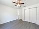 Bright bedroom with gray flooring, ceiling fan, and closet at 22777 Sw Beach Blvd, Dunnellon, FL 34431