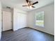 Bedroom featuring a ceiling fan, window, and closet at 22777 Sw Beach Blvd, Dunnellon, FL 34431
