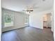 Spacious bedroom featuring wood floors, two windows for ample natural light, and an ensuite bathroom at 22777 Sw Beach Blvd, Dunnellon, FL 34431
