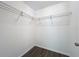 Walk-in closet with metal shelving and neutral colored walls for ample storage at 22777 Sw Beach Blvd, Dunnellon, FL 34431