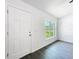 Bright entryway featuring modern floors, a window for natural light and a white front door at 22777 Sw Beach Blvd, Dunnellon, FL 34431