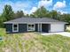 Charming single-story home featuring a well-maintained lawn and a spacious two-car garage at 22777 Sw Beach Blvd, Dunnellon, FL 34431