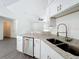Modern kitchen featuring stainless dishwasher, granite counters, and bright natural light at 22777 Sw Beach Blvd, Dunnellon, FL 34431