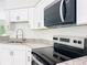 Open kitchen area features granite countertops and stainless steel appliances at 22777 Sw Beach Blvd, Dunnellon, FL 34431