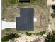 An aerial shot of a home's roof with a modern design, clean gutters, and ample space for expansion at 22777 Sw Beach Blvd, Dunnellon, FL 34431