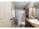 Bathroom featuring a shower and tub combination, vanity and medicine cabinet for all your needs at 2690 Sw 154Th Ln, Ocala, FL 34473