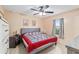 Comfortable bedroom with ceiling fan, neutral walls, tile flooring, and ample natural light at 2690 Sw 154Th Ln, Ocala, FL 34473