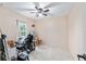 Bedroom with ceiling fan, tile flooring, window and accessible accomodations at 2690 Sw 154Th Ln, Ocala, FL 34473