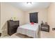 Cozy bedroom with a comfortable bed, dresser, and nightstand, perfect for relaxation at 2690 Sw 154Th Ln, Ocala, FL 34473