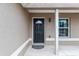 Close up of the front door with decorative glass, a digital lock, and a welcome mat at 2690 Sw 154Th Ln, Ocala, FL 34473