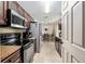 View of kitchen featuring stainless steel appliances and a view to the dining room at 2690 Sw 154Th Ln, Ocala, FL 34473