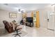 Bright living room featuring tile floors, a ceiling fan, neutral-toned walls, and an entertainment center at 2690 Sw 154Th Ln, Ocala, FL 34473