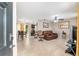 Open-concept floor plan with tile floors, a comfortable leather sofa, a ceiling fan, and dining area at 2690 Sw 154Th Ln, Ocala, FL 34473