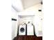 Laundry room with washer, dryer, and shelving at 3005 Ne 19Th Ave, Ocala, FL 34479
