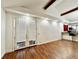Bright living room features hardwood floors, french doors, and a kitchen bar with modern finishes at 3005 Ne 19Th Ave, Ocala, FL 34479