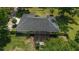 Overhead shot showcasing the home's roof and outdoor pergola, beautifully landscaped at 3880 Sw 6Th Ave, Ocala, FL 34471