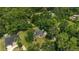 Aerial view of home featuring landscaping, mature trees, and neighborhood setting at 3880 Sw 6Th Ave, Ocala, FL 34471
