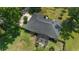 Aerial view of the home with a large roof, covered pergola, and landscaping at 3880 Sw 6Th Ave, Ocala, FL 34471