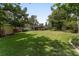Spacious backyard with lush lawn and mature trees offering a private and tranquil outdoor setting at 3880 Sw 6Th Ave, Ocala, FL 34471