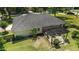 Aerial view of the home with a covered patio and a landscaped yard at 3880 Sw 6Th Ave, Ocala, FL 34471