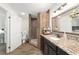 Bathroom with a walk-in tiled shower and a granite-topped vanity at 3880 Sw 6Th Ave, Ocala, FL 34471